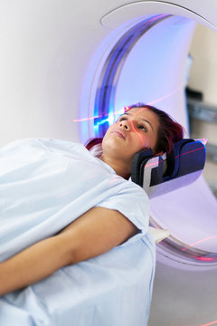 Woman being examined in an MRI scanner