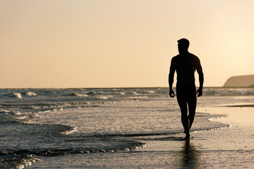 Naked man in the beach of Fuerteventura, Spain.