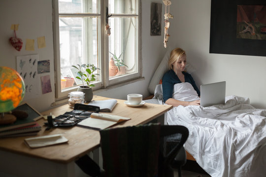 Woman is working on a laptop