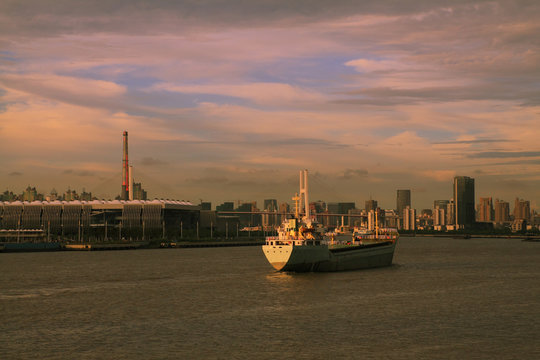 Modern buildings and a ship on the sea cityscape skyline