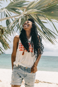 Portrait of a beautiful african american woman at the beach