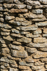 gray wall of limestone stones