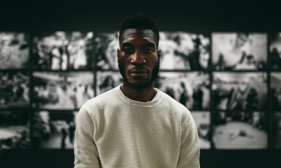 Black serious man looking at camera