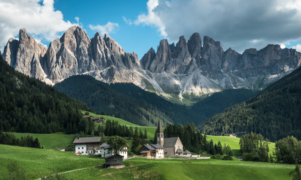 Santa Magdalena church paints a fairytale picture.  Dolomites. Italy