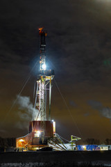 The beautiful sunrise landscape of Drilling rig in onshore oilfield of Russia. Oil drilling rig operation on the oil platform in oil and gas industry