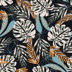 Abstract seamless pattern with tropical leaves on a dark background. Vector design. Jungle print. Textiles and printing.