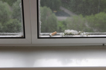 Sliding mosquito net on the balcony that protects against cigarette butts, dust and poplar fluff