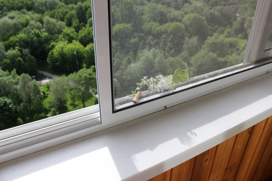 Sliding Mosquito Net On The Balcony That Protects Against Cigarette Butts, Dust And Poplar Fluff