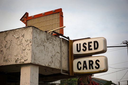 Aged and worn vintage udes cars sign