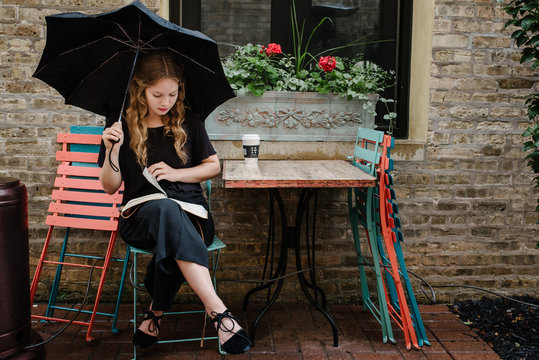 Girl With Umbrella Reading