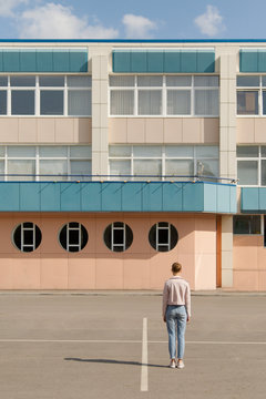 Woman standing at modern building