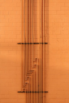Orange Wall with Network Pipes