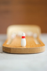 close up of mini game bowling wood