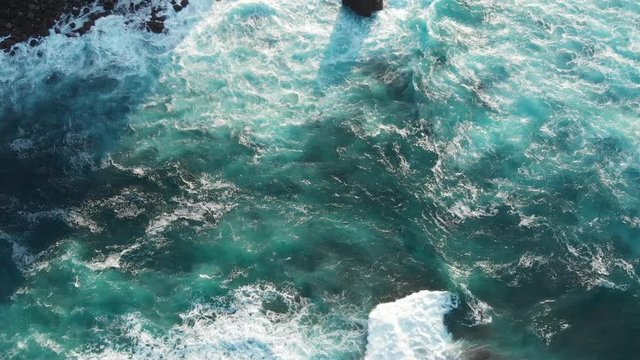 Aerial Drone tilt over turquoise sea