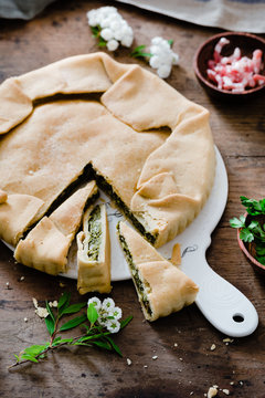 Savory pie stuffed with vegetables and bacon