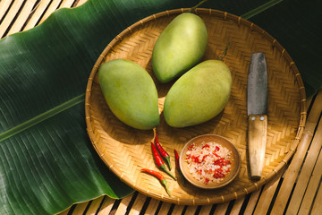 Fresh green mango with salt mix chili.