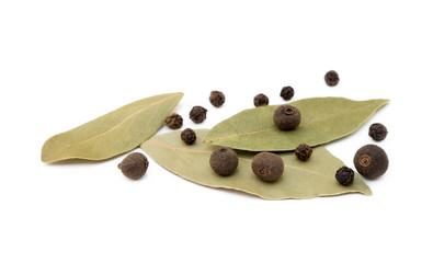 Bay leaf, allspice and pepper isolated on white background