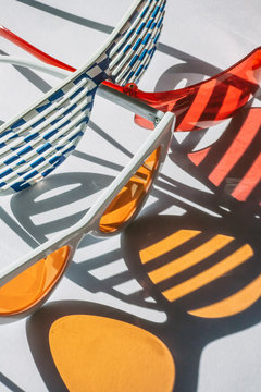 three pairs of colorful sunglasses, shadow, white background, unreal,colorful,travel, vacation, creative, trip, summer