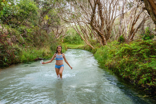 girl walking in a freshwater stream