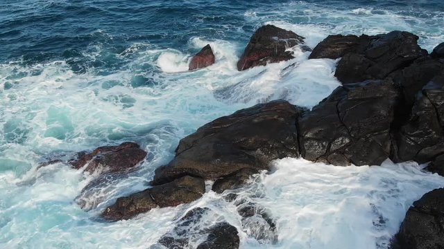 Aerial Drone Azores Portugal waves crashing on rocks turquoise water