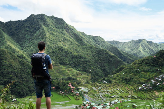 Tourist watching panoramic views of rice terrace while in a private tour.
