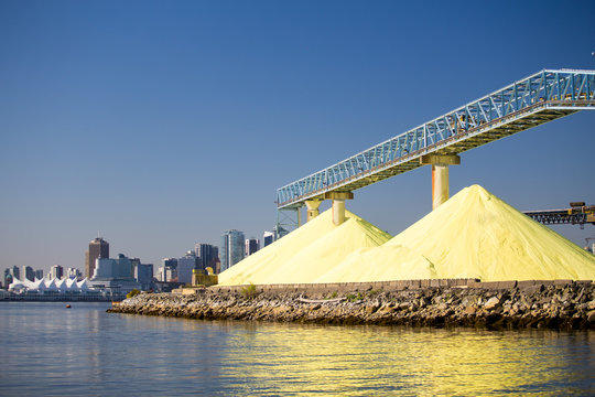 Sulphur shipping facility in front of the Vancouver skyline