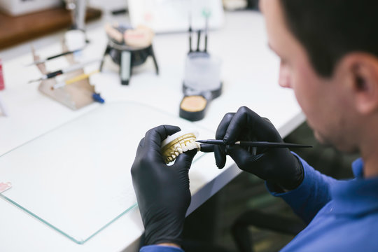 Dental technician making new teeth