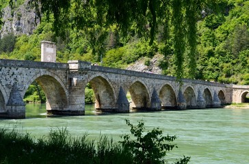 Fototapeta na wymiar old stone bridge on the river