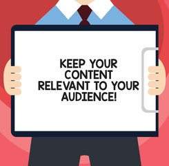 Handwriting text writing Keep Your Content Relevant To Your Audience. Concept meaning Good marketing strategies Man in Suit Standing Holding Horizontally Clipboard with Blank Paper