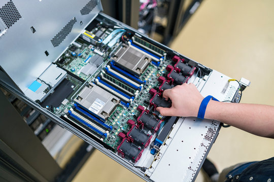 Close-up of teenager working at server