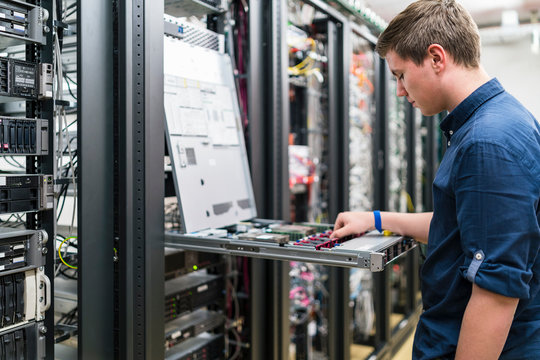 Teenager working in server room