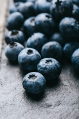 Fresh blueberry background. Texture blueberry berries close up. Vegan and vegetarian concept.