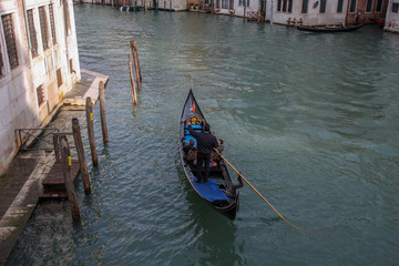 Fototapeta na wymiar Canal with gondolas in Venice, Italy. Architecture and landmarks of Venice. 