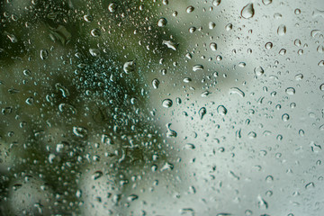 blur backgruond,Rain water on the car glass.