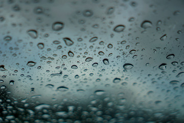 blur backgruond,Rain water on the car glass.