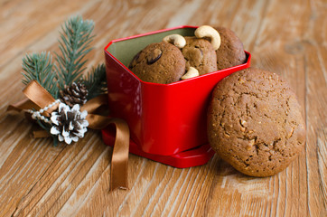 Set of homemade coffee cookies with chocolate in red box on wooden background
