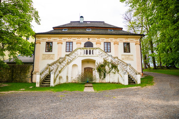 Peacock on territory of medieval castle Blatna in spring time, Czech Republic