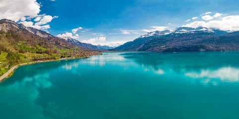 Brienz town on lake Brienz by Interlaken with the Swiss Alps covered by snow in the background,...