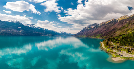 Fototapeta premium Brienz town on lake Brienz by Interlaken with the Swiss Alps covered by snow in the background, Switzerland, Europe