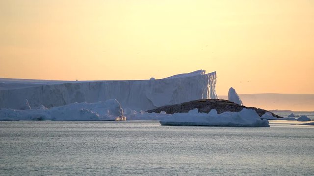 Massive glacier at sunset in Ilulissat icefjord, Greenland