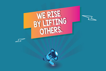 Word writing text We Rise By Lifting Others.. Business concept for Team Spirit we feel Abundant with possibility.