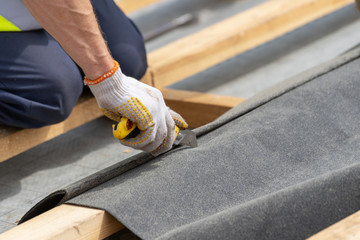 Building construction process of new wooden roof on wood frame house