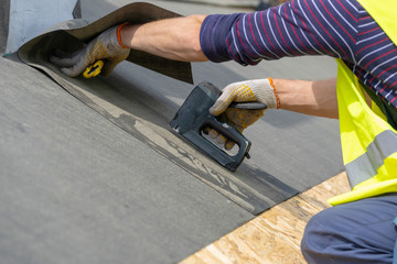 Building construction process of new wooden roof on wood frame house