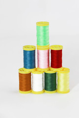colorful threads for sewing or embroidery on a white background