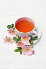 Herbal tea with dog rose flowers for healthy life