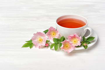 Herbal tea with dog rose flowers for healthy life