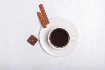 Coffee cup top view on wooden white table background