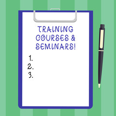 Handwriting text Training Courses And Seminars. Concept meaning Education professional learning improvement Blank Sheet of Bond Paper on Clipboard with Click Ballpoint Pen Text Space