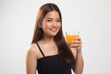 Young Asian woman drink orange juice.