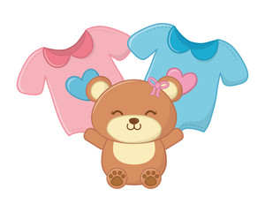 toy bear and baby clothes